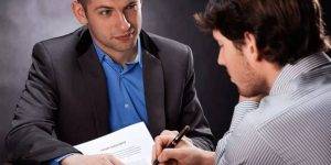 A private investigator discussing details with a corporate client.

