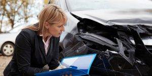 Insurance investigator tactics while examining a wrecked car.