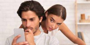 Wife catching husband with evidence of infidelity, revealing a cheating partner."